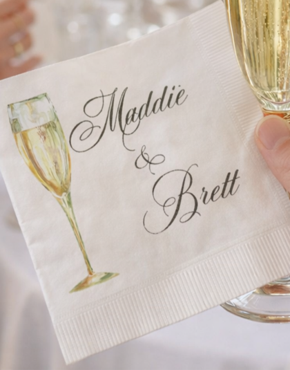 Elegant cocktail napkins with champagne glass and formal script lettering