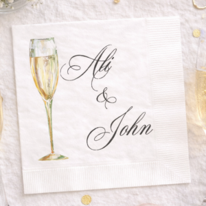cocktail napkins with names and champagne glass for a n engagement party