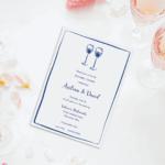Rehearsal dinner party invitation with wine glasses