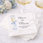 Personalized bridal shower napkins with blue bow champagne glass